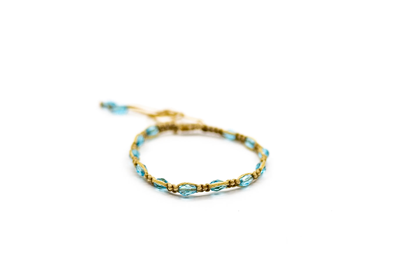 PALM STRINGS - SMALL OVAL SKY BLUE CRYSTALS ON SAND STRING