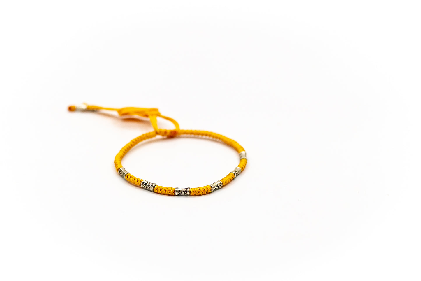 PSB700 - Silver Thin Bracelet on Light Orange Round Knot