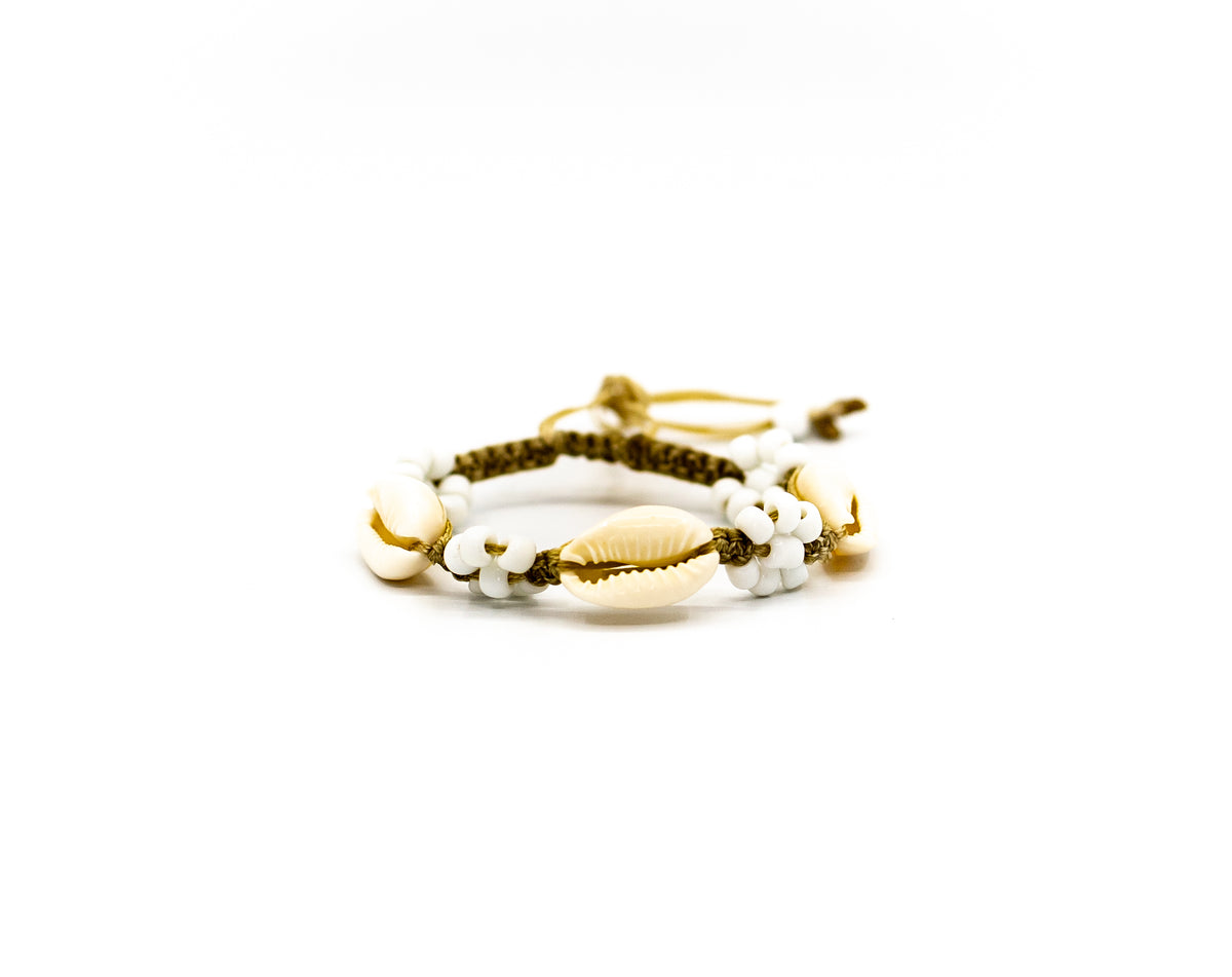PSB121 - Cowrie Shell Bracelet with White Flower Beads on Sand String