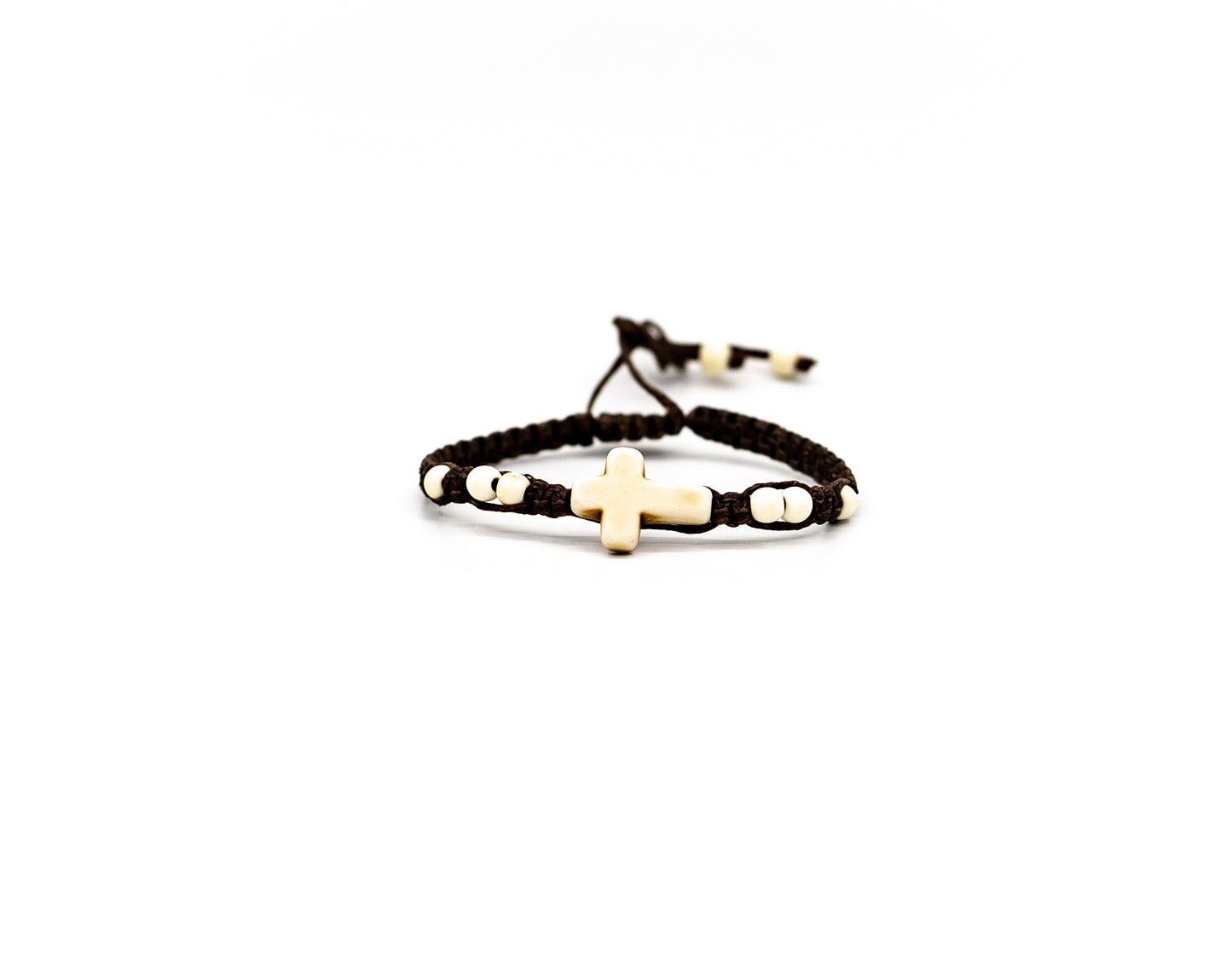 PALM STRINGS - SMALL STONE IVORY CROSS WITH MINI WHITE BEADS BROWN STRING