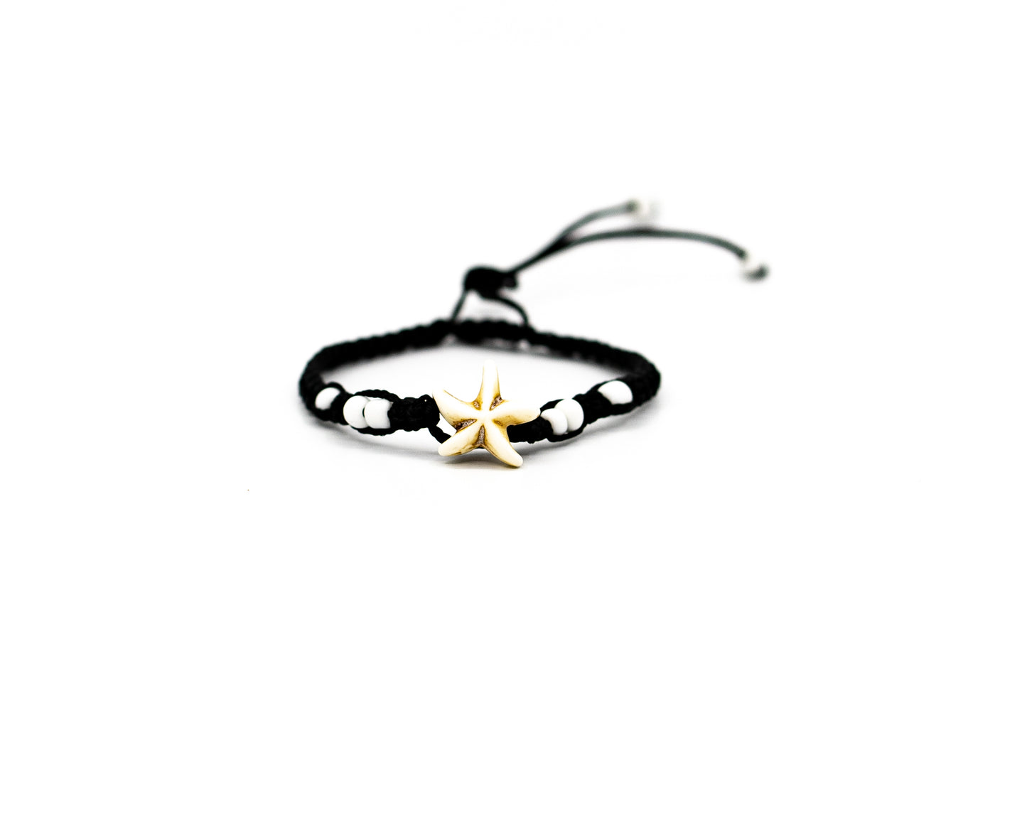 PALM STRINGS - SINGLE MEDIUM WHITE STARFISH WITH SMALL WHITE BEADS BLACK STRING