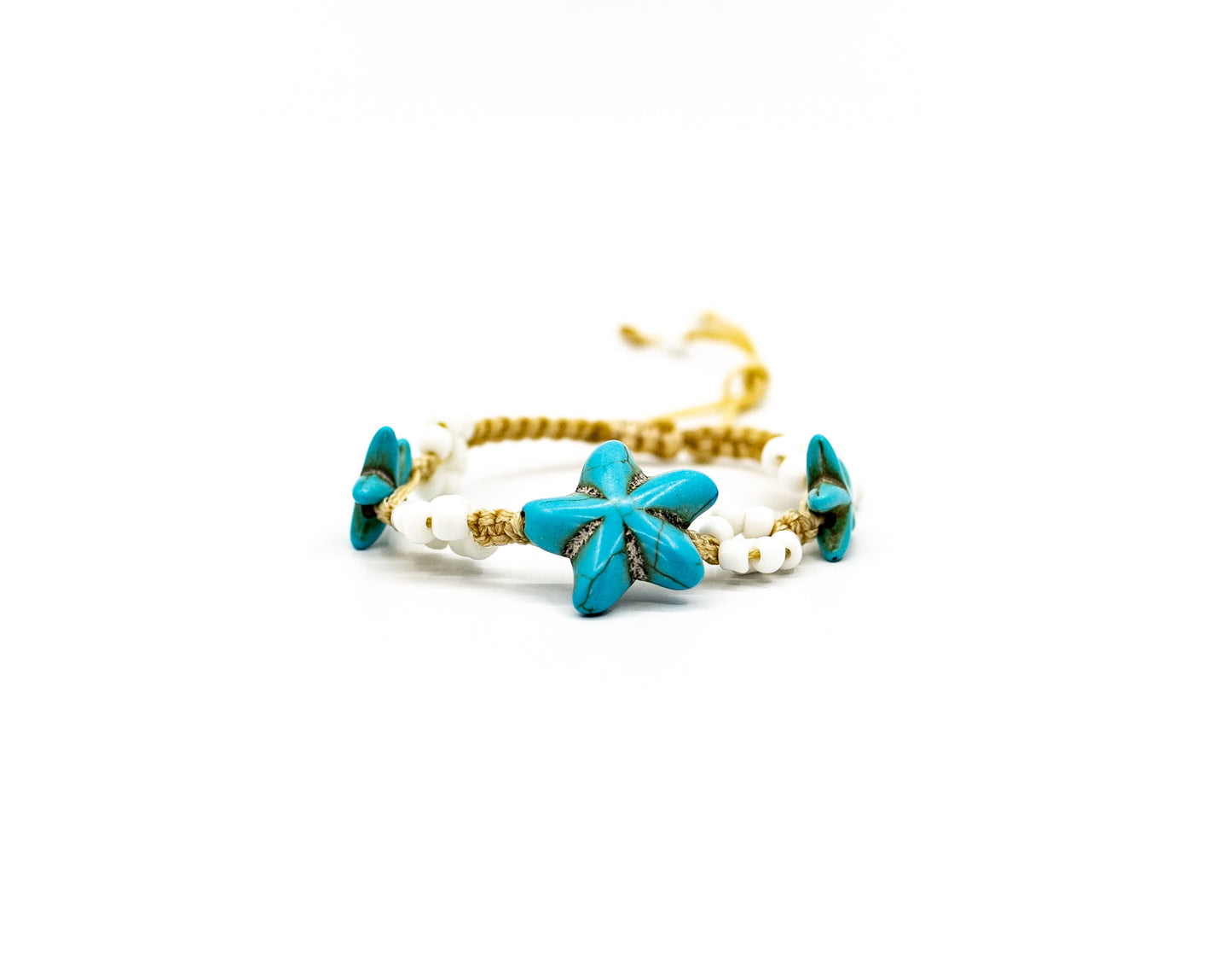 PALM STRINGS - ASSORTED STONE TURQUOISE STARFISH WITH WHITE FLOWERS ON CREAM STRING