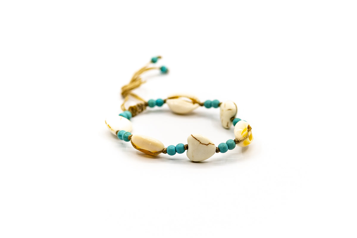PSB553 - Cowrie Shell and Heart Bracelet with Small Turquoise Beads on Sand String