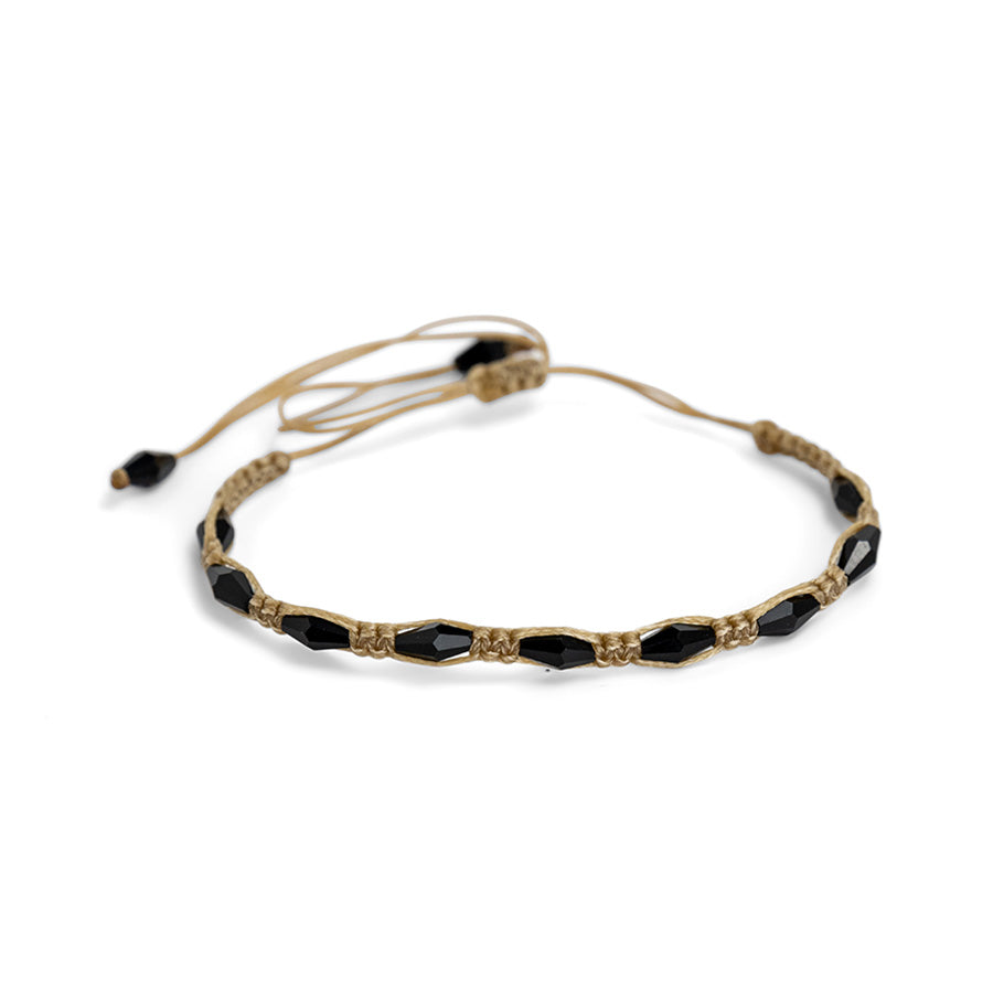 PALM STRINGS - SMALL OVAL BLACK CRYSTALS ON SAND STRING