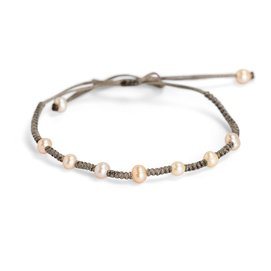 PALM STRINGS - PINK POT PEARLS ON TATORA STRING ROUND KNOT