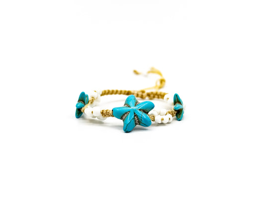 PALM STRINGS - ASSORTED STONE TURQUOISE STARFISH WITH WHITE FLOWERS ON CREAM STRING
