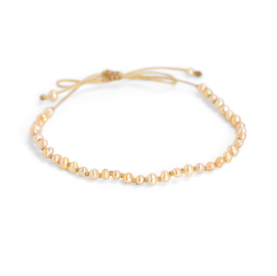 PALM STRINGS - TINY PINK PEARLS ON KNOTTED SAND STRING